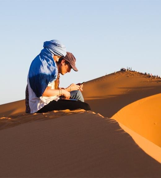 Couple Sitting in Dubai Desert